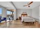 Large bedroom with seating area, ceiling fan and access to the balcony at 3512 Portiani Dr, Las Vegas, NV 89141