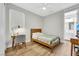 Cozy bedroom featuring hardwood floors, natural light, and modern decor at 3512 Portiani Dr, Las Vegas, NV 89141