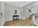 Entryway with decorative wall trim, wood floors, and an accent table with decor at 3512 Portiani Dr, Las Vegas, NV 89141