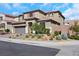 Two-story home with desert landscaping, tile roof, and a two car garage on a sunny day at 3512 Portiani Dr, Las Vegas, NV 89141