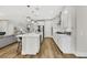 Bright, modern kitchen with white cabinets, stainless steel appliances, and a large center island at 3512 Portiani Dr, Las Vegas, NV 89141