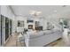 Bright living room with hardwood floors, modern decor, and large windows, offering a comfortable and stylish living space at 3512 Portiani Dr, Las Vegas, NV 89141