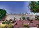 Backyard featuring desert landscaping, including cactuses and a view of the cityscape at 3942 Delos Dr, Las Vegas, NV 89103