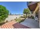 Private backyard includes a deck, a patio and desert landscaping at 3942 Delos Dr, Las Vegas, NV 89103