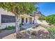 Charming backyard patio with desert landscaping and shade, perfect for outdoor relaxation and entertaining guests at 3942 Delos Dr, Las Vegas, NV 89103