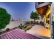 Private backyard with patio, desert landscaping, and city views at night at 3942 Delos Dr, Las Vegas, NV 89103