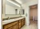 Bathroom featuring double sinks and a view of the toilet room at 3942 Delos Dr, Las Vegas, NV 89103