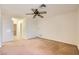 Spacious carpeted bedroom features ceiling fan and neutral tones at 3942 Delos Dr, Las Vegas, NV 89103