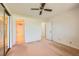 Bedroom showing neutral carpet, ceiling fan, and closet doors at 3942 Delos Dr, Las Vegas, NV 89103
