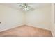 Neutral bedroom featuring a ceiling fan and soft, neutral carpet at 3942 Delos Dr, Las Vegas, NV 89103
