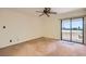 Bedroom with a large sliding glass door and a view of the city's buildings at 3942 Delos Dr, Las Vegas, NV 89103