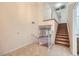 Inviting entryway featuring tiled floors, staircase, and open view to the living area offering a spacious feel at 3942 Delos Dr, Las Vegas, NV 89103