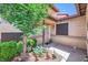 Charming front entrance with a beautiful tree and well-maintained landscaping at 3942 Delos Dr, Las Vegas, NV 89103