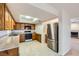 Well-equipped kitchen with stainless steel appliances and breakfast bar at 3942 Delos Dr, Las Vegas, NV 89103