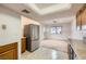 Bright kitchen area adjacent to a dining room with neutral carpet at 3942 Delos Dr, Las Vegas, NV 89103