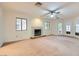 Spacious living room offering a fireplace and lots of natural light from windows at 3942 Delos Dr, Las Vegas, NV 89103