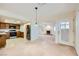 Open-concept living space features a kitchen, dining area, and living room with a cozy fireplace at 3942 Delos Dr, Las Vegas, NV 89103