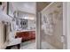 Bathroom featuring a glass shower and a vanity with modern fixtures and ample counter space at 4050 Pacific Harbors Dr # 107, Las Vegas, NV 89121