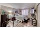 Cozy bedroom with wood floors, a large window, and neutral decor for a restful retreat at 4050 Pacific Harbors Dr # 107, Las Vegas, NV 89121