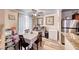 Dining room with table next to kitchen appliances at 4050 Pacific Harbors Dr # 107, Las Vegas, NV 89121