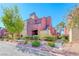 A colorful two-story condo with vibrant landscaping at 4050 Pacific Harbors Dr # 107, Las Vegas, NV 89121