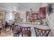 Open concept kitchen featuring breakfast bar and stainless appliances at 4050 Pacific Harbors Dr # 107, Las Vegas, NV 89121