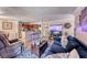 Wide angle view of condo living room with kitchen in background at 4050 Pacific Harbors Dr # 107, Las Vegas, NV 89121