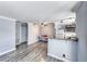 Kitchen and dining area with ceiling fan, track lighting, and views of the living space at 4050 Pacific Harbors Dr # 245, Las Vegas, NV 89121