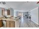 Kitchen with breakfast bar overlooking an open-concept living area with fireplace at 4050 Pacific Harbors Dr # 245, Las Vegas, NV 89121