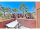 Balcony with table and chairs overlooks landscaped community at 4050 Pacific Harbors Dr # 245, Las Vegas, NV 89121