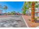 Neighborhood street view showcasing the well-maintained landscaping, palm trees, and tidy community at 4050 Pacific Harbors Dr # 245, Las Vegas, NV 89121