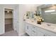 Bright bathroom featuring a double vanity with white cabinets and a glass-enclosed shower at 4180 E Brusca Way, Pahrump, NV 89061