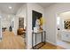 Inviting hallway with stylish decor, leading to a living area and bathroom at 4180 E Brusca Way, Pahrump, NV 89061