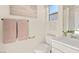 Cozy bathroom with a toilet, sink, and a mirror at 4200 E Brusca Way, Pahrump, NV 89061