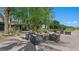 Inviting outdoor seating area features comfortable chairs, a fire pit, and lush landscaping at 4200 E Brusca Way, Pahrump, NV 89061