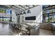 A community kitchen featuring an island with bar seating, pendant lighting, and stainless steel appliances at 4200 E Brusca Way, Pahrump, NV 89061