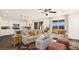 A well-lit living room and kitchen with an open floor plan featuring stylish decor, and modern appliances at 4200 E Brusca Way, Pahrump, NV 89061