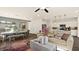 A well-lit living room and kitchen with an open floor plan featuring stylish decor, and modern appliances at 4200 E Brusca Way, Pahrump, NV 89061