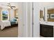 View of bedroom featuring modern decor, large window and ensuite bathroom at 4250 E Brusca Way, Pahrump, NV 89061