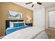 Bedroom features overhead fan, closet, and neutral walls with a view to an ensuite bathroom at 4250 E Brusca Way, Pahrump, NV 89061