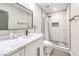 Bathroom featuring a sink vanity and tiled shower with glass doors at 4437 Alto Verde Dr, Las Vegas, NV 89119