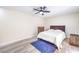 Bedroom featuring a queen bed, ceiling fan, and light colored walls at 4437 Alto Verde Dr, Las Vegas, NV 89119