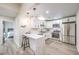 Modern kitchen featuring white cabinets, stainless steel appliances, and a breakfast bar at 4437 Alto Verde Dr, Las Vegas, NV 89119