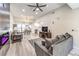 Bright living room with a modern fireplace, ceiling fan, and lots of natural light at 4437 Alto Verde Dr, Las Vegas, NV 89119