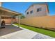 Outdoor patio space with artificial grass and a BBQ grill, perfect for entertaining and enjoying the backyard at 4507 Grotto Ct, North Las Vegas, NV 89031