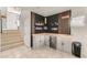 Unique built-in bar area features modern decor and beverage refrigerator, perfect for entertaining at 4507 Grotto Ct, North Las Vegas, NV 89031