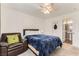 Inviting bedroom with a comfortable bed, cozy chair, and neutral tones, creating a relaxing and welcoming atmosphere at 4507 Grotto Ct, North Las Vegas, NV 89031