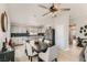 Bright dining area boasts modern light fixture and flows into the updated kitchen with black backsplash at 4507 Grotto Ct, North Las Vegas, NV 89031