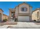 Charming home with a two-car garage and a welcoming front entrance at 4507 Grotto Ct, North Las Vegas, NV 89031
