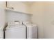 Practical laundry area with modern appliances, offering convenience and efficiency for everyday chores at 4507 Grotto Ct, North Las Vegas, NV 89031